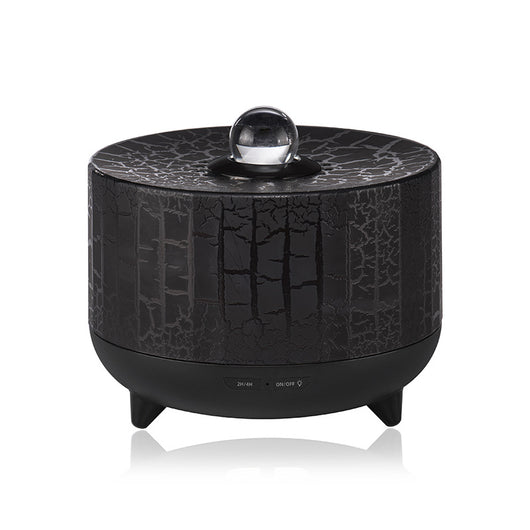 Black cylindrical aromatherapy diffuser with a crackle pattern, clear spherical top, and control buttons for timer and light. - Image 3