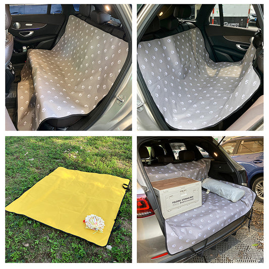 Pink car pet mat with white paw print and bone patterns, featuring black straps for securing to a rear seat. - Image 2