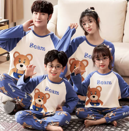 Family of four wearing matching yellow long-sleeved cotton pajamas with a cute panda design and "HUG ME!" text. - Image 4