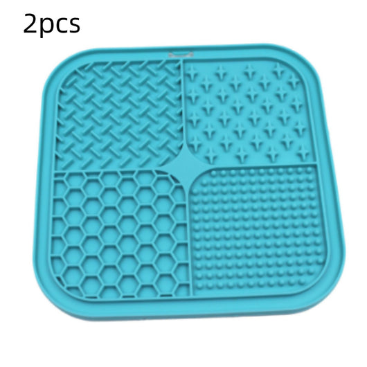 Gray silicone pet licking pad with four textured sections, designed for slow feeding and anti-choking. - Image 10