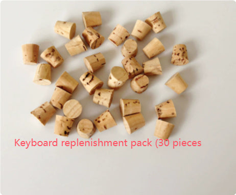Pile of 30 small, light brown wooden stoppers, replacement buttons for a parrot keyboard toy. - Image 12