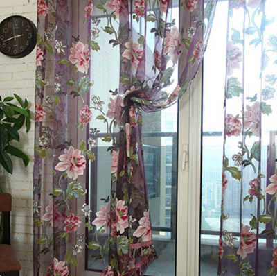 Light brown sheer window curtain with a floral jacquard burnt-out pattern, hung with grommets and styled with tie-backs. - Image 6