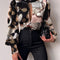 Blusa Elegante de Cuello Alto con Mangas Globo y Detalles Recortados