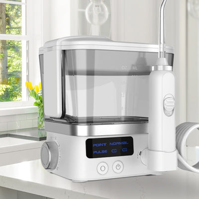 White household handheld portable oral irrigator with 600ml water tank, LED display, two nozzle tips, and USB cable.