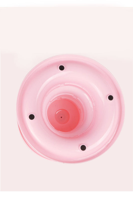 Brown tabby cat sniffing a black and orange multi-level rotating cat plate toy with colorful balls and bunny ears. - Image 12