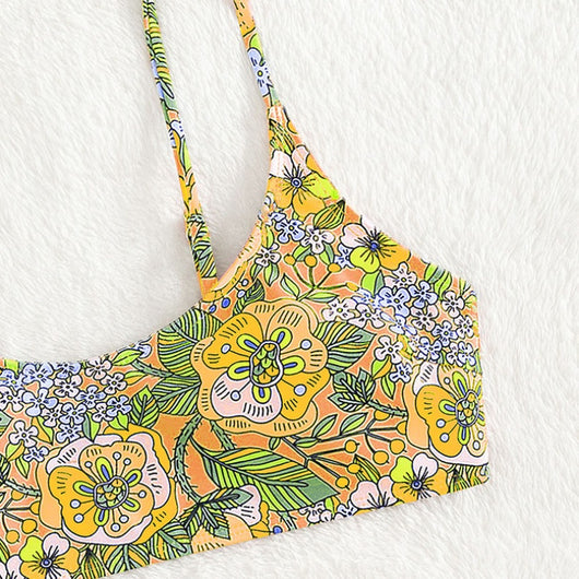 New printed bikini swimsuit with a vibrant floral pattern on a light blue background, featuring a scoop neck top and high-cut bottom. - Image 7
