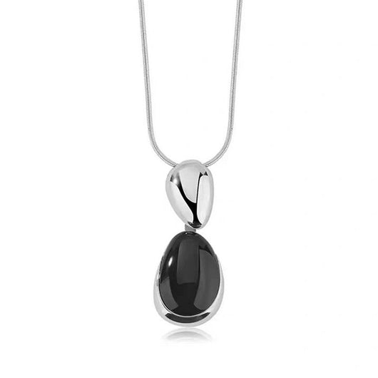 Pair of gold-toned irregular earrings with black onyx-like inserts, featuring a modern, abstract design. - Image 5