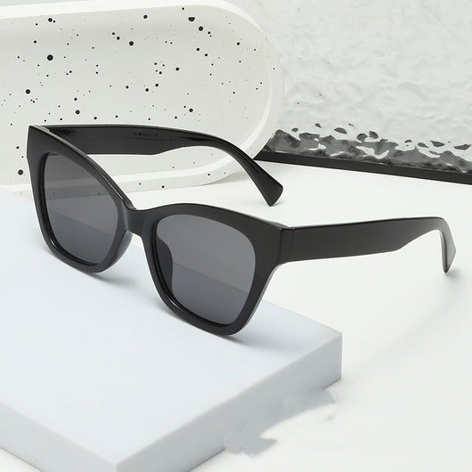 Fashion sunglasses with clear oval frames, dark gray lenses, and tortoise shell patterned temples. - Image 16