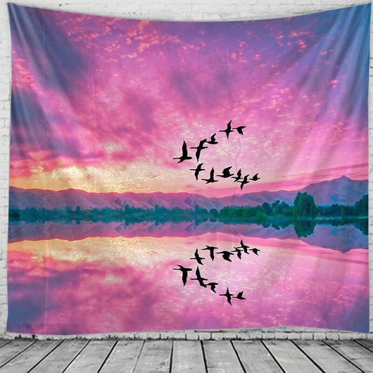 Rectangular tapestry with a vibrant pink and purple sunset sky, silhouetted birds flying, and a reflective lake with distant mountains. - Image 2