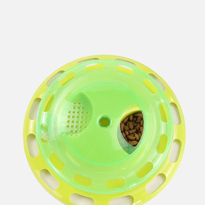 Green and yellow two-tier interactive cat toy turntable with a bell ball in the track and kibble in the top compartment. - Image 5