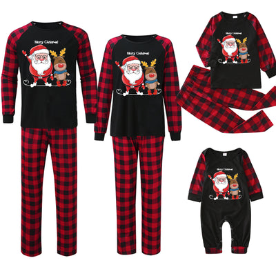 Family matching Christmas pajamas with black tops, red and black buffalo plaid sleeves and pants, featuring Santa and reindeer graphic. - Image 2