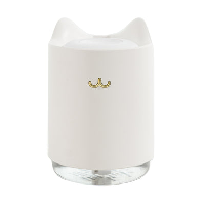 White mini USB humidifier with cat ears and a gold cat nose/mouth emblem, featuring a clear water tank base. - Image 10
