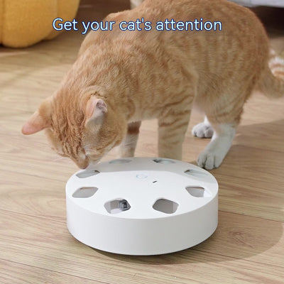 Light blue circular cat teaser toy with multiple cutouts and a red feather extending from one opening. - Image 2