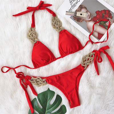White two-piece bikini with gold braided knot details on the halter straps and tie-side bottom, laid flat. - Image 14