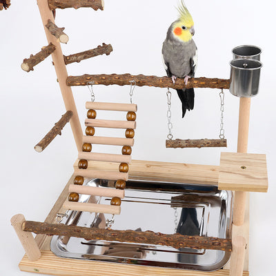 Multi-level natural wood parrot play stand with perches, ladder, swings, and two stainless steel feeding cups. - Image 3