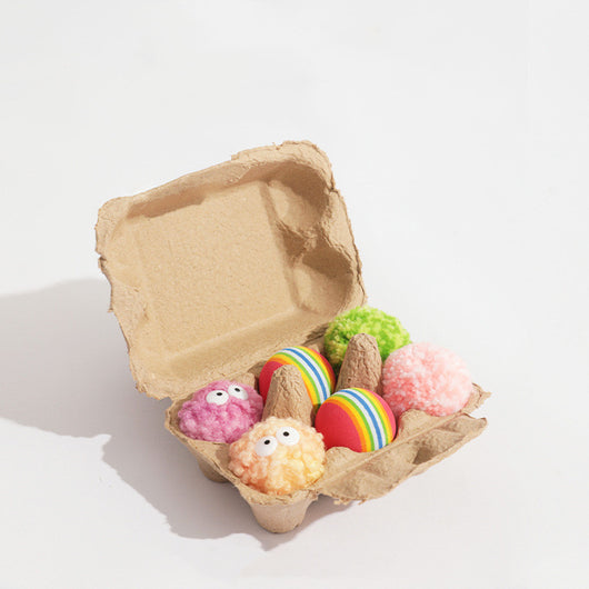 Assortment of soft, colorful yarn ball dog toys with built-in bells, featuring various patterns and textures. - Image 7