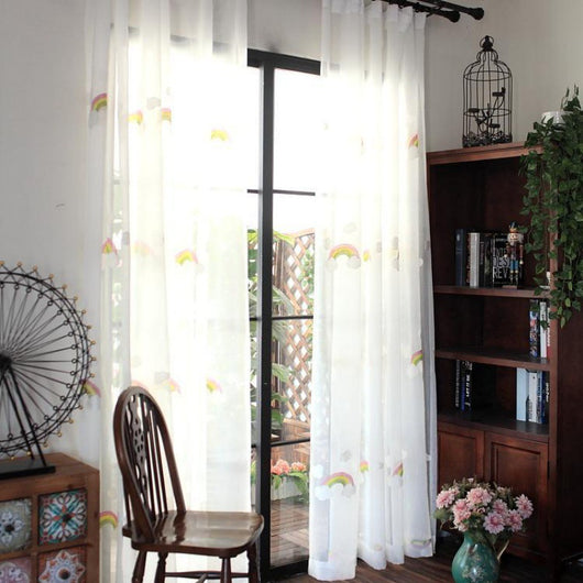 White sheer gauze curtain with colorful embroidered rainbows and grey clouds, suitable for a child's room. - Image 5