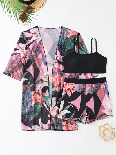 Woman in a three-piece bikini swimsuit set with a black tube top, floral boy shorts, and a sheer floral kimono cover-up. - Image 15