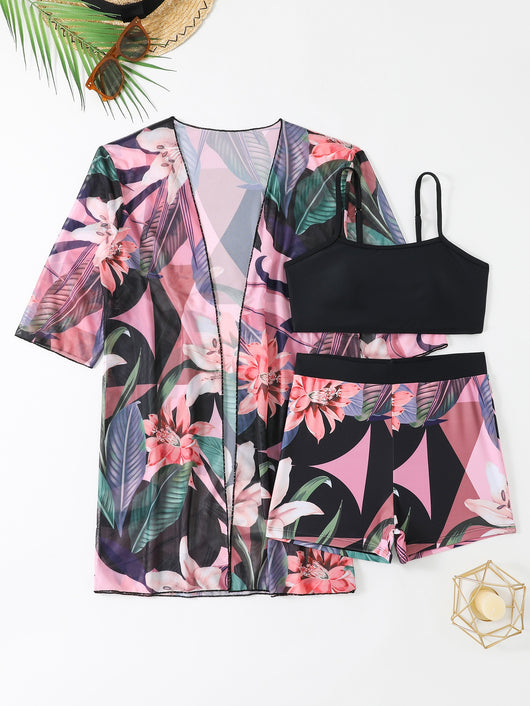 Woman in a three-piece bikini swimsuit set with a black tube top, floral boy shorts, and a sheer floral kimono cover-up. - Image 15