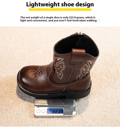 Girls' brown Martin boots with white ethnic embroidery, side zippers, and black soles, displayed on a light carpet. - Image 19