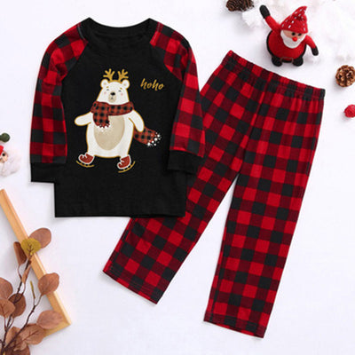 Kids' Christmas pajamas with a black long-sleeve top featuring a cartoon bear in a plaid scarf and ice skates, paired with red and black plaid pants. - Image 9