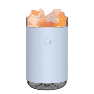 Pink cylindrical humidifier and essential oil diffuser with glowing orange crystal salt stones and a clear base. - Image 9