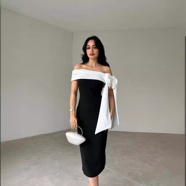 Vestido de Cóctel Elegante con Hombros Descubiertos y Moño en Blanco y Negro
