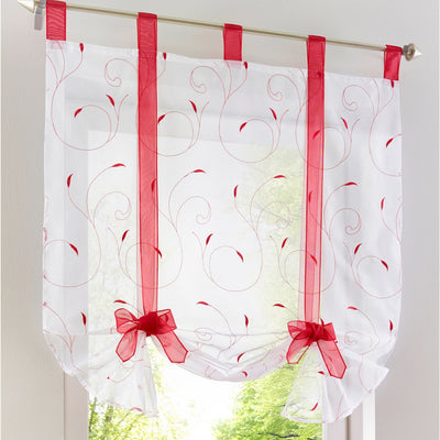 White sheer Roman window screen with red embroidered floral patterns and red ribbon ties, hanging from a silver rod.