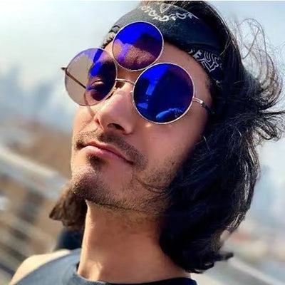 Red lens round sunglasses with a gold metal frame and an extra small round lens above the left eye. - Image 16