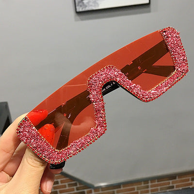 Black square sunglasses with a wavy top frame embellished with brown and clear rhinestones and gradient smoke lenses. - Image 11