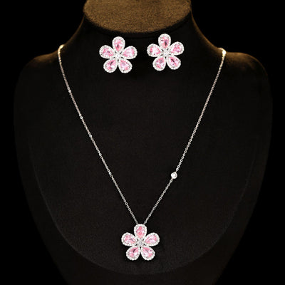 Elegant jewelry set with a silver-tone necklace and matching stud earrings, featuring blue and clear floral gemstones. - Image 5