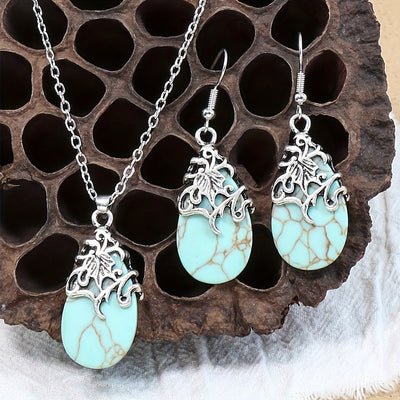 Vintage-style silver-tone necklace and dangle earrings set with oval frames and marbled blue and yellow stones. - Image 2