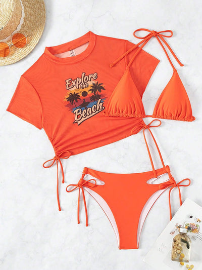 Black three-piece swimsuit with a mesh crop top featuring an "Explore the Beach" graphic, bikini top, and high-waisted bottoms. - Image 37
