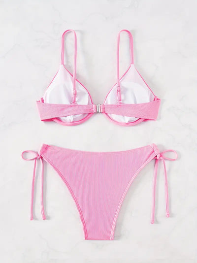Black ribbed two-piece bikini with an underwire top and tie-side bottoms on a white marble surface. - Image 25