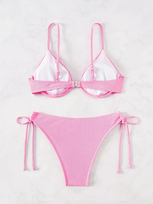 Black ribbed two-piece bikini with an underwire top and tie-side bottoms on a white marble surface. - Image 25