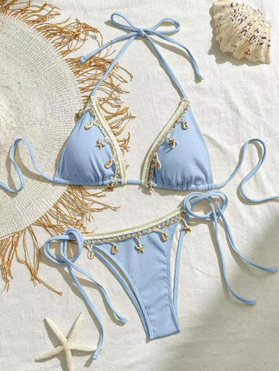 Light pink ribbed halterneck bikini with triangle cups and tie-side bottom, adorned with shell and starfish charms. - Image 8