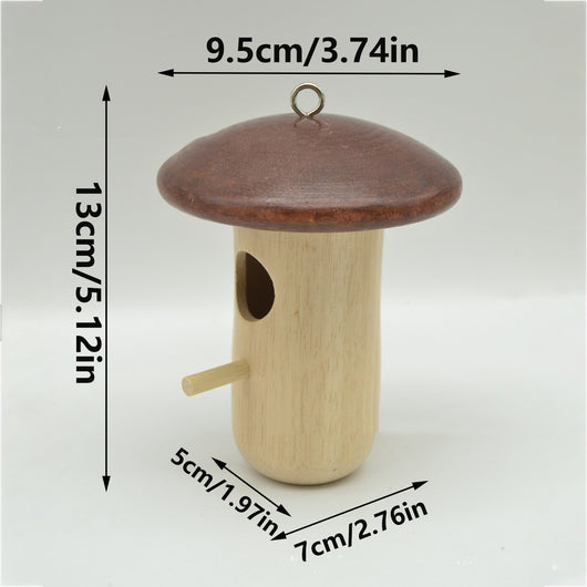Wooden mushroom-shaped hummingbird feeder with a dark brown cap and light wood body, featuring an entrance hole and perch, held in a hand outdoors. - Image 4