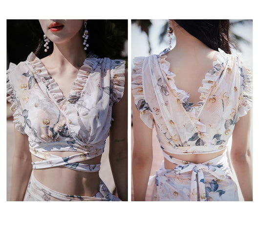 Women's three-piece swimwear set with a cream floral print, ruffled crop top, high-waisted shorts, and matching sarong. - Image 16