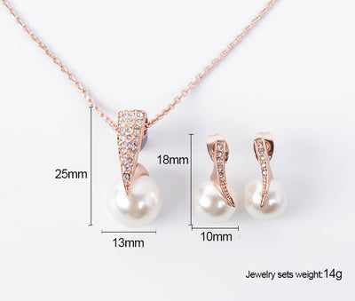 Rose gold-toned necklace and drop earrings set with white spherical pearls and clear rhinestone accents. - Image 6