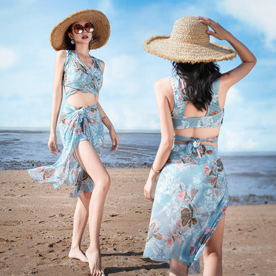 Women's light blue tropical leaf print three-piece swimsuit with short sleeve bikini top, bottoms, and sarong skirt. - Image 8