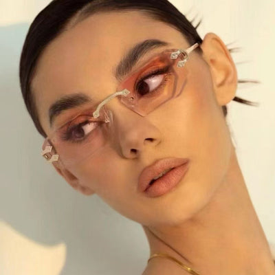 Rimless octagonal clear lens glasses with silver-toned metal temples and black ear tips, featuring decorative accents. - Image 12