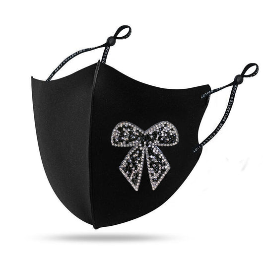 Black cloth face mask with a sparkling red and silver rhinestone bow design and adjustable ear loops. - Image 11