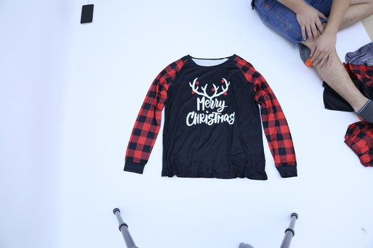 Black and red buffalo plaid pajama set with 'Merry Christmas' and reindeer antlers on the long-sleeved top. - Image 7