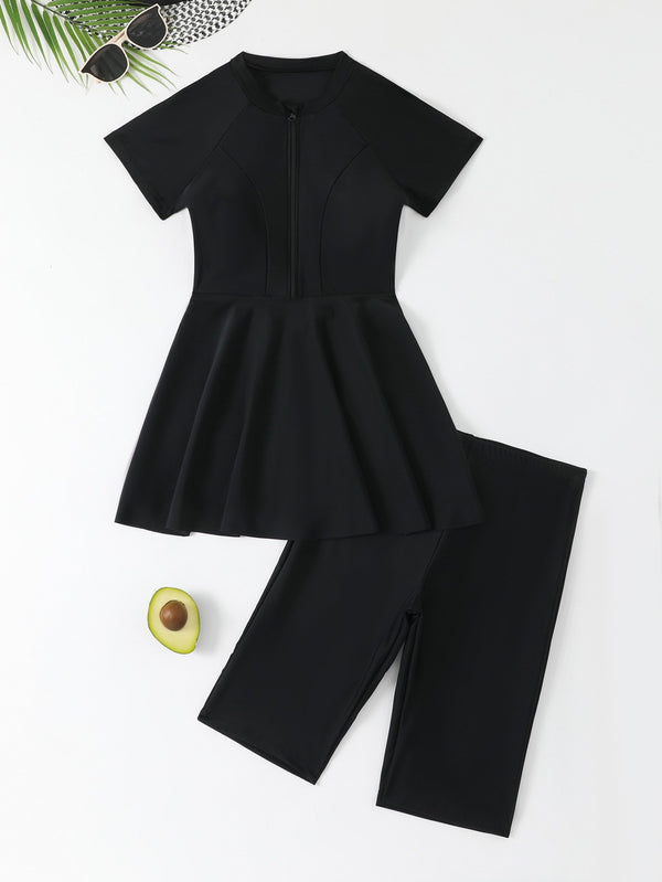 Navy blue two-piece conservative swimwear with short-sleeve peplum top and mid-length shorts, featuring a front zipper. - Image 6