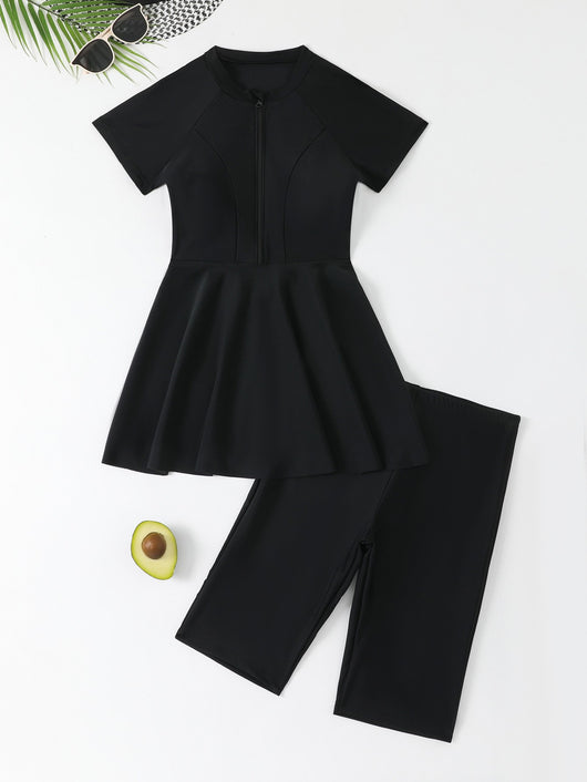 Navy blue two-piece conservative swimwear with short-sleeve peplum top and mid-length shorts, featuring a front zipper. - Image 6