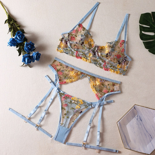 Yellow sheer floral embroidered lingerie set with a bra, thong, and two leg rings, laid flat. - Image 9