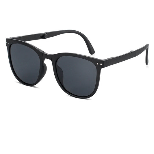 Beige oval-frame sunglasses with brown polarized lenses and foldable temples on a white background.