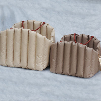 Light khaki quilted portable pet carrier with brown handles and a cream shoulder strap for car travel. - Image 3