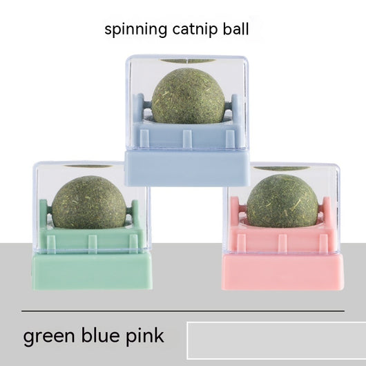 Two spinning catnip balls, one with a green base and one with a blue base, in clear plastic cases. - Image 7
