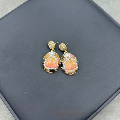 Gold-toned dangle earrings with oval drops, featuring a carved pink flower, clear rhinestones, and multi-colored tourmaline. - Image 7